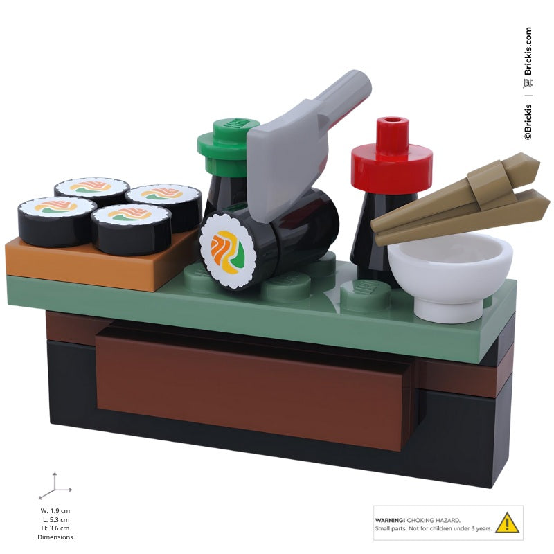 
                  
                    LEGO sushi bar scene showing Japanese cuisine details with mini sushi maki rolls, chopsticks, and dipping soy sauce bottle
                  
                