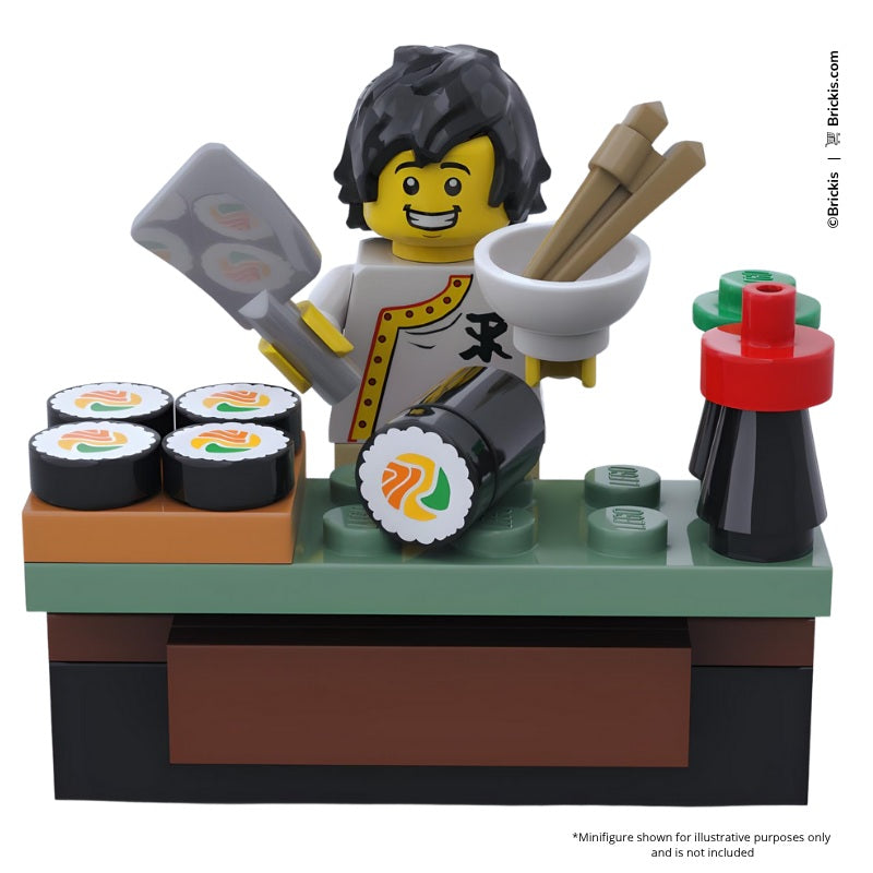 
                  
                    Mini LEGO sushi bar with sushi rolls, soy sauce, and chopsticks in a Japanese-themed display
                  
                