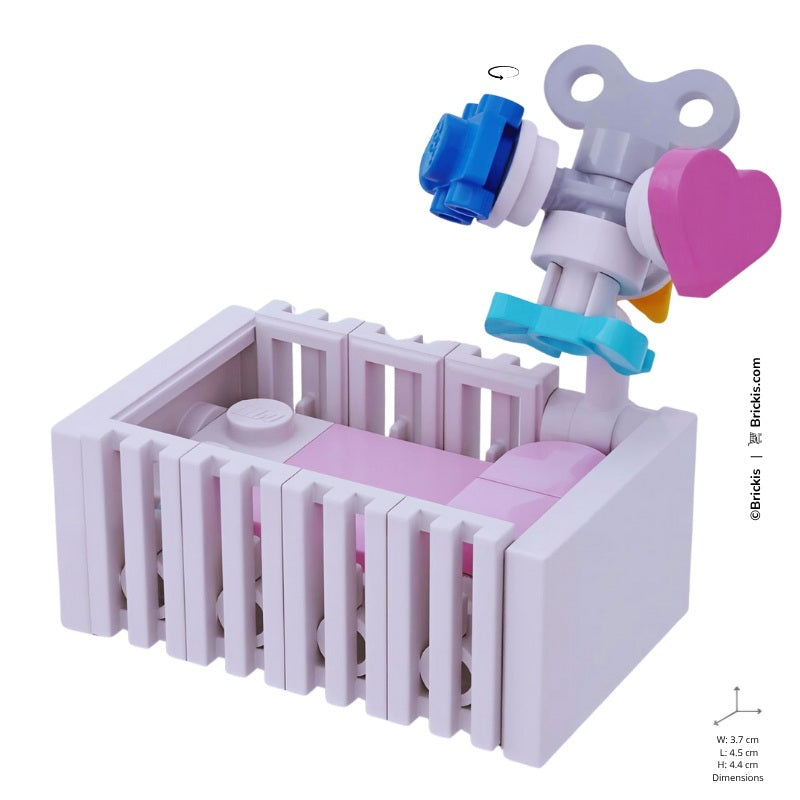 
                  
                    LEGO baby girl crib build in soft white and pink, perfect for baby shower gifts and nursery displays
                  
                