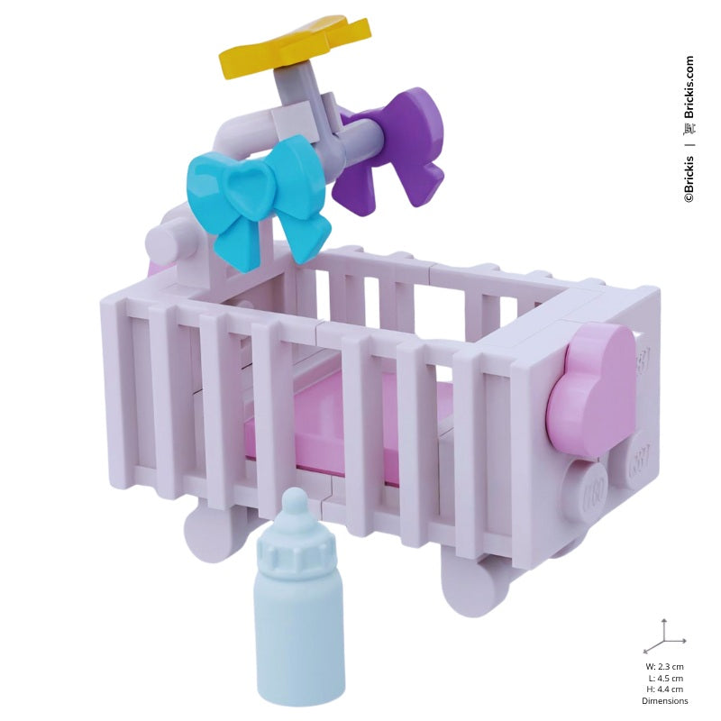 Delicate LEGO baby crib in white and pink with spinning mobile, perfect for welcoming a new baby or celebrating a tender nursery moment.