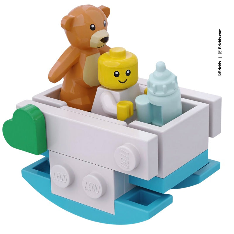 LEGO baby rocking cradle in turquoise with teddy bear and bottle – nursery mini build by Brickis
