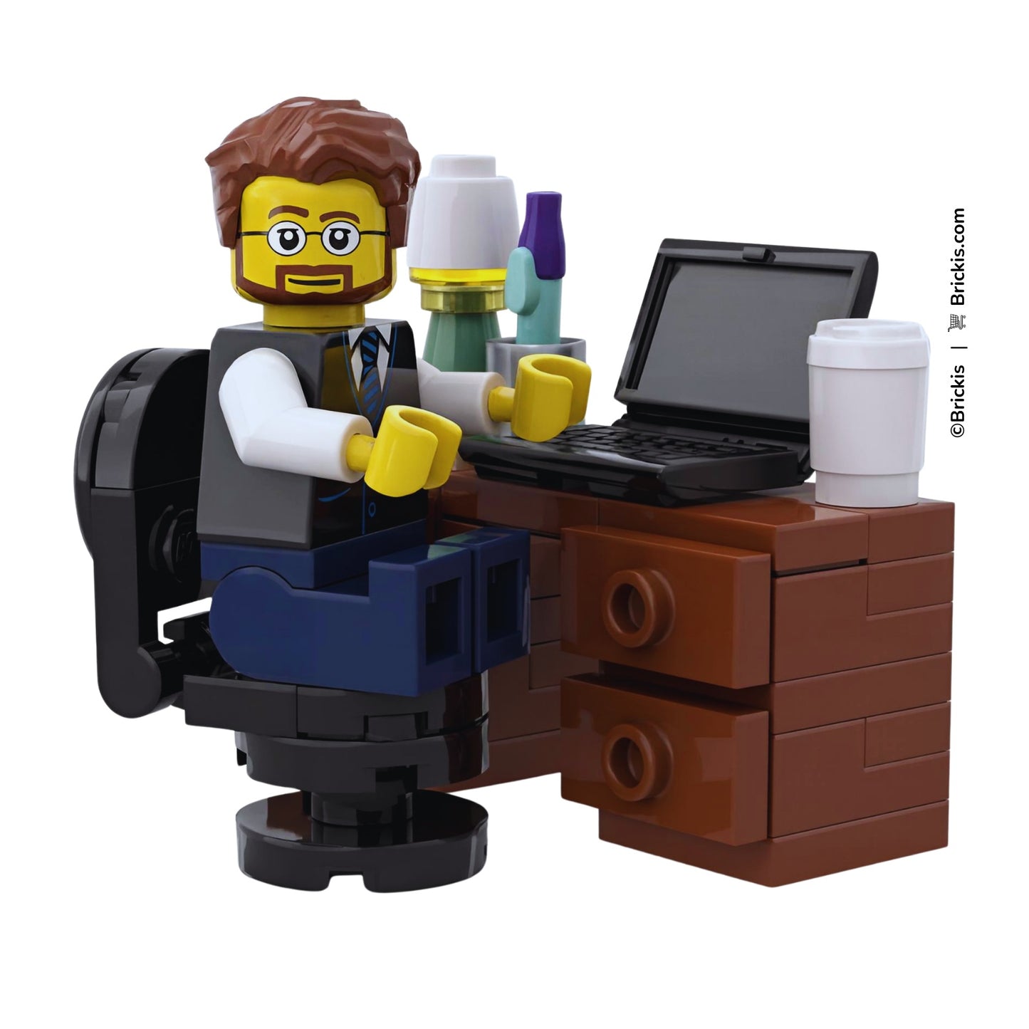 Custom LEGO home office computer desk with laptop, coffee cup and desk lamp shown with a working minifigure.