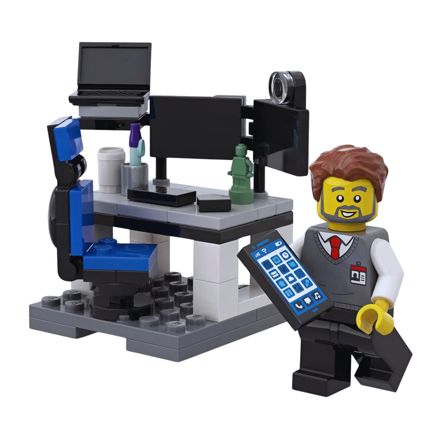 LEGO developer computer desk with dual monitors, laptop stand and smartphone detail.