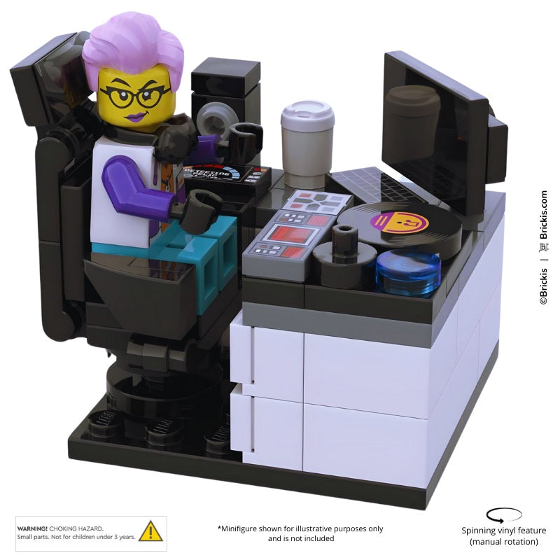 LEGO DJ desk with speakers, vinyl disc, and mixing equipment.