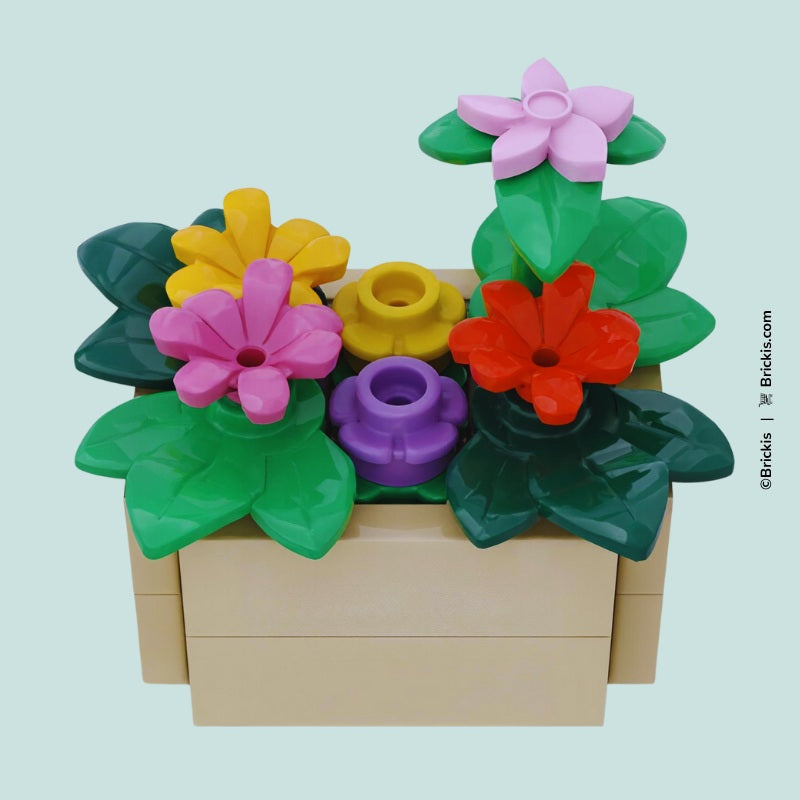 
                  
                    Custom LEGO flower box planter featuring vibrant mini flowers and green leaf details – part of the Botanix Collection by Brickis
                  
                