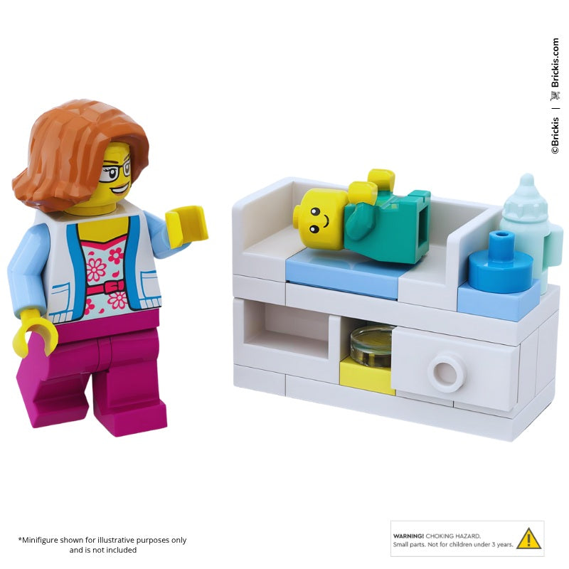 Custom LEGO baby changing station MOC with minifigure-scale nursery accessories, diaper table, and baby bottle designed by Brickis.