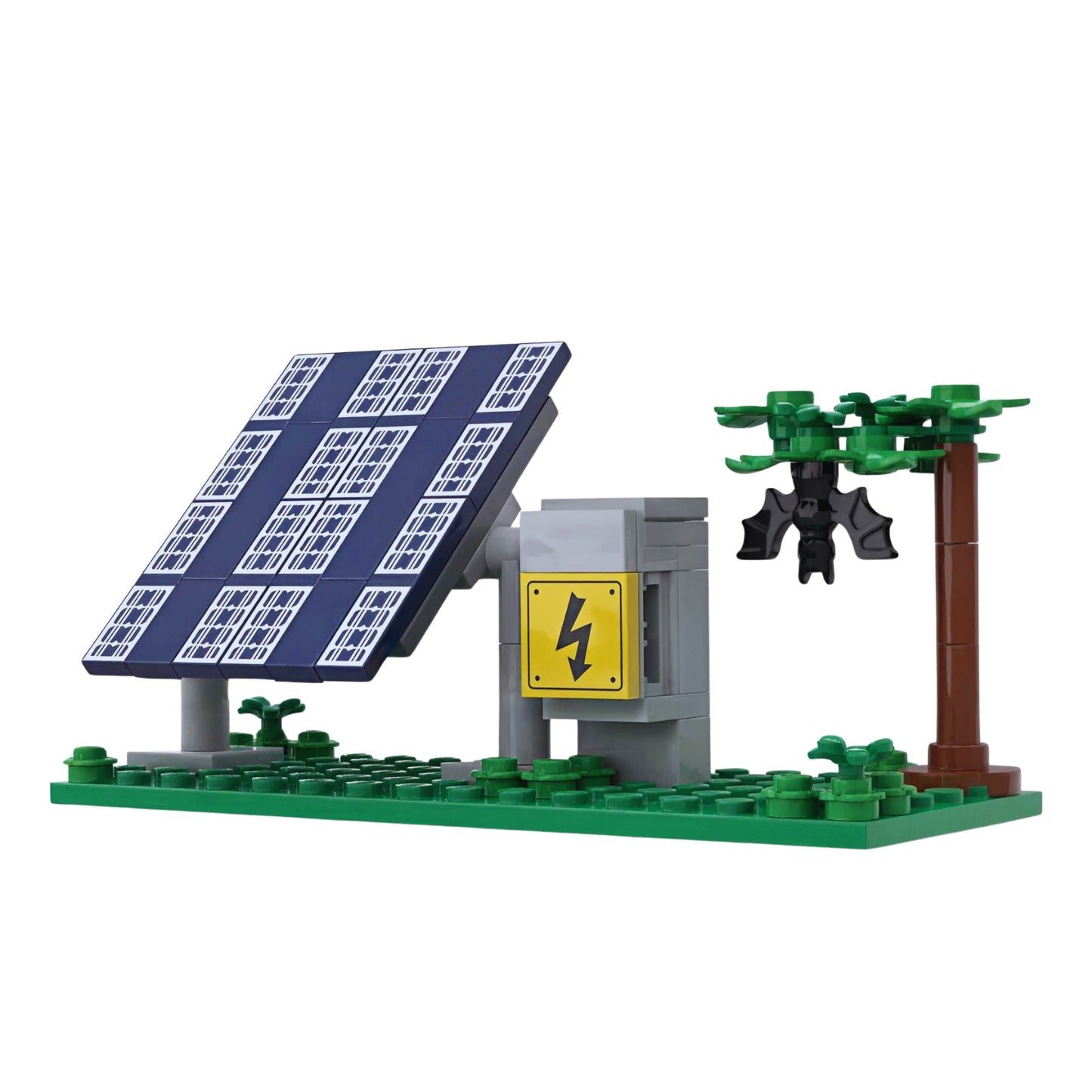 Custom LEGO renewable energy model featuring solar panel system and bat habitat integrated in surrounding tree