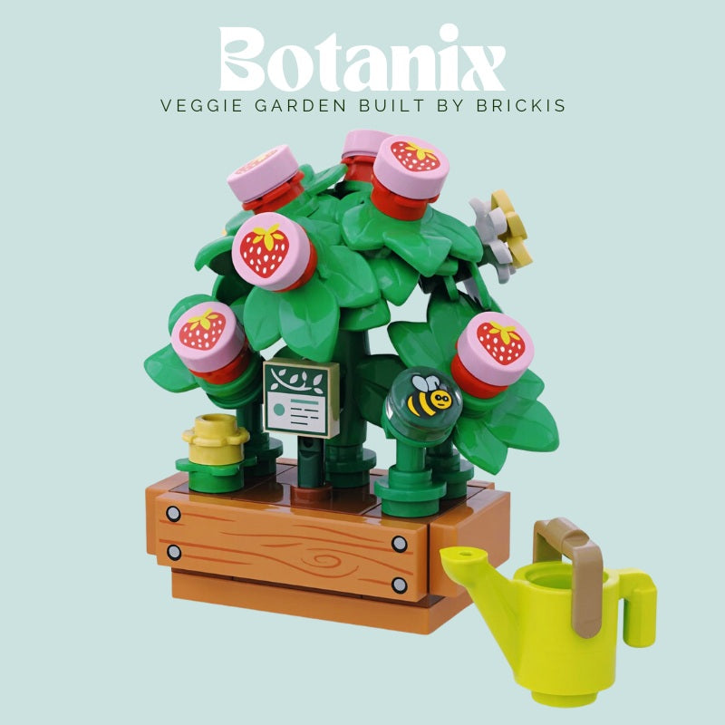 
                  
                    LEGO botanical strawberry plant in planter box with bee pollinating flowers and ripe fruit for display or gifting
                  
                