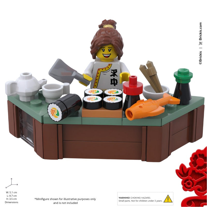LEGO sushi bar with maki rolls, salmon, soy sauce bottles, and chopsticks in minifigure scale